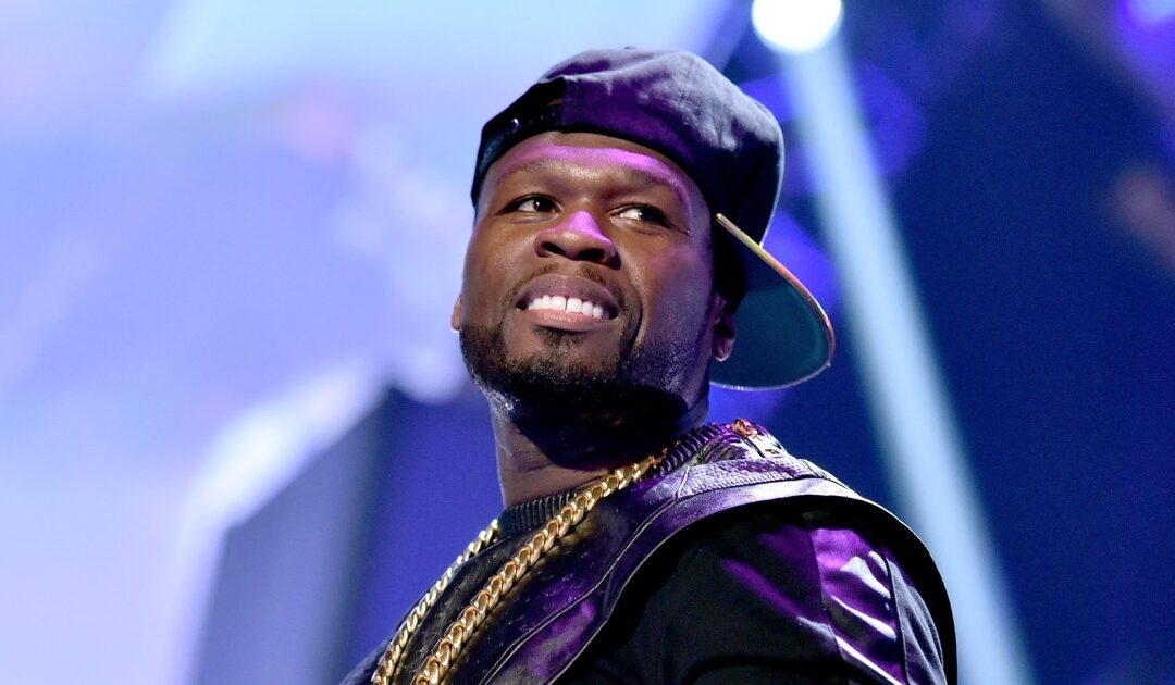 50 Cent hurls a microphone offstage during a concert, allegedly hits a woman